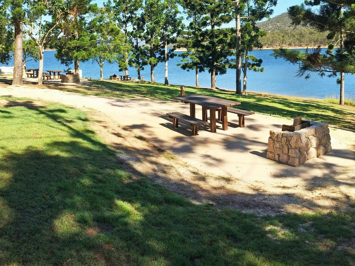 At Platypus day-use area enjoy a picnic in the shade of hoop pines beside Lake Tinaroo.