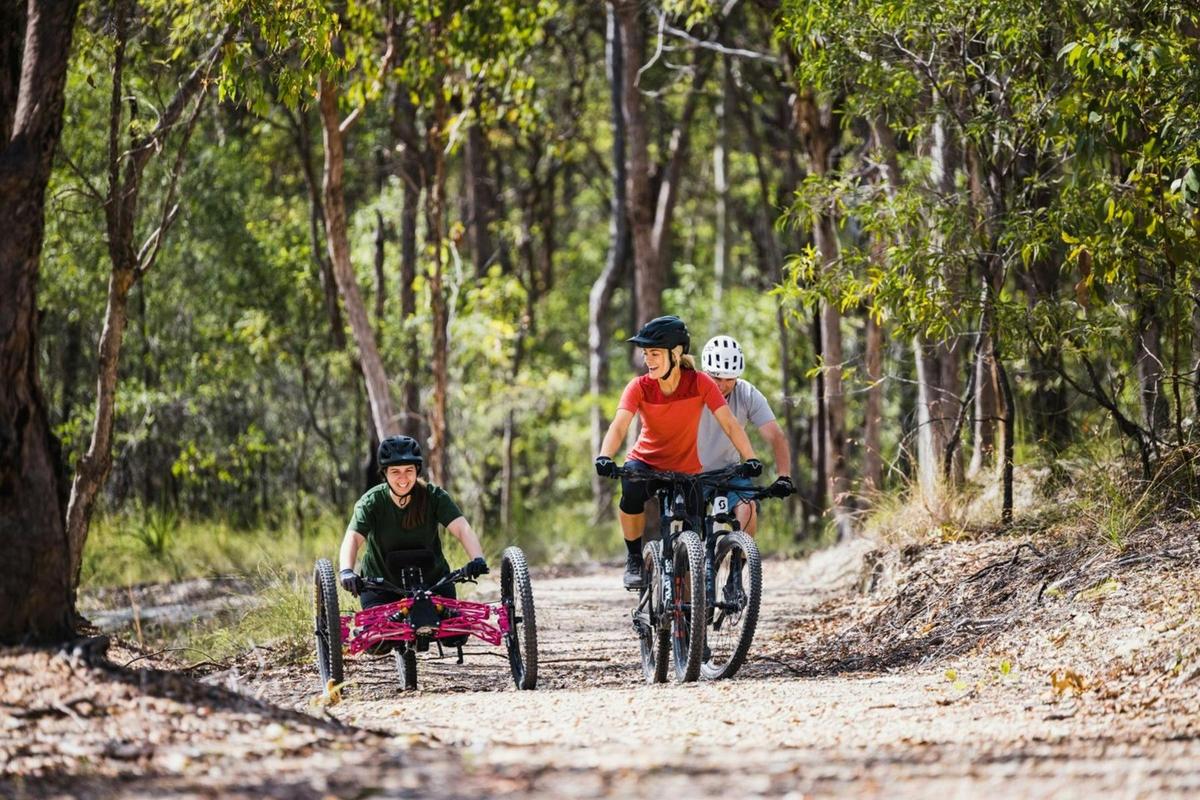 Cyclists and adaptive riders exploring Eastern Escarpment Conservation Area trails