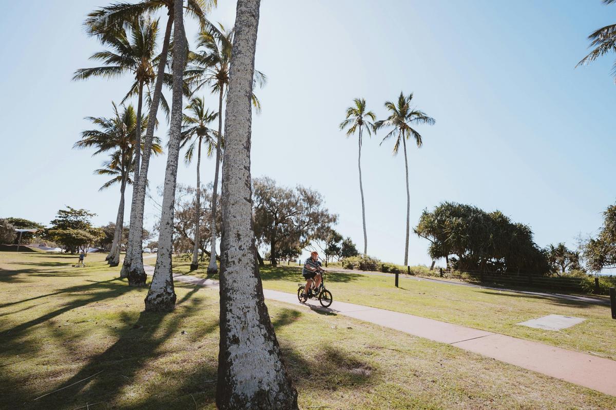 Guests riding a bike at the park