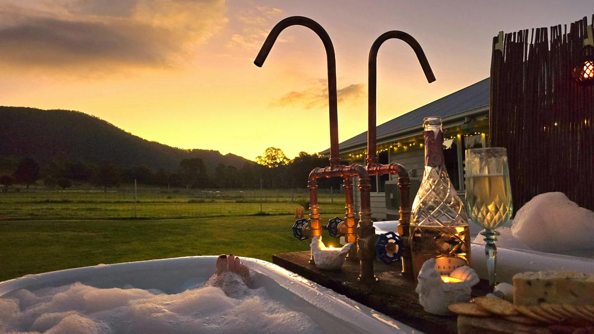 Relax in piping hot water in the dual outdoor baths overlooking the mountains at Fig Tree Farm B&B.
