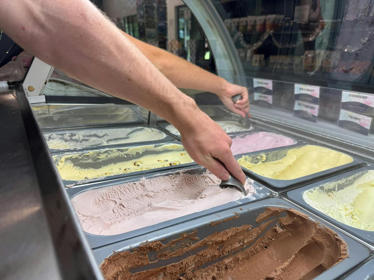 Scooping Ice Cream from Our display cabinets - Over 35 flavours to choose from