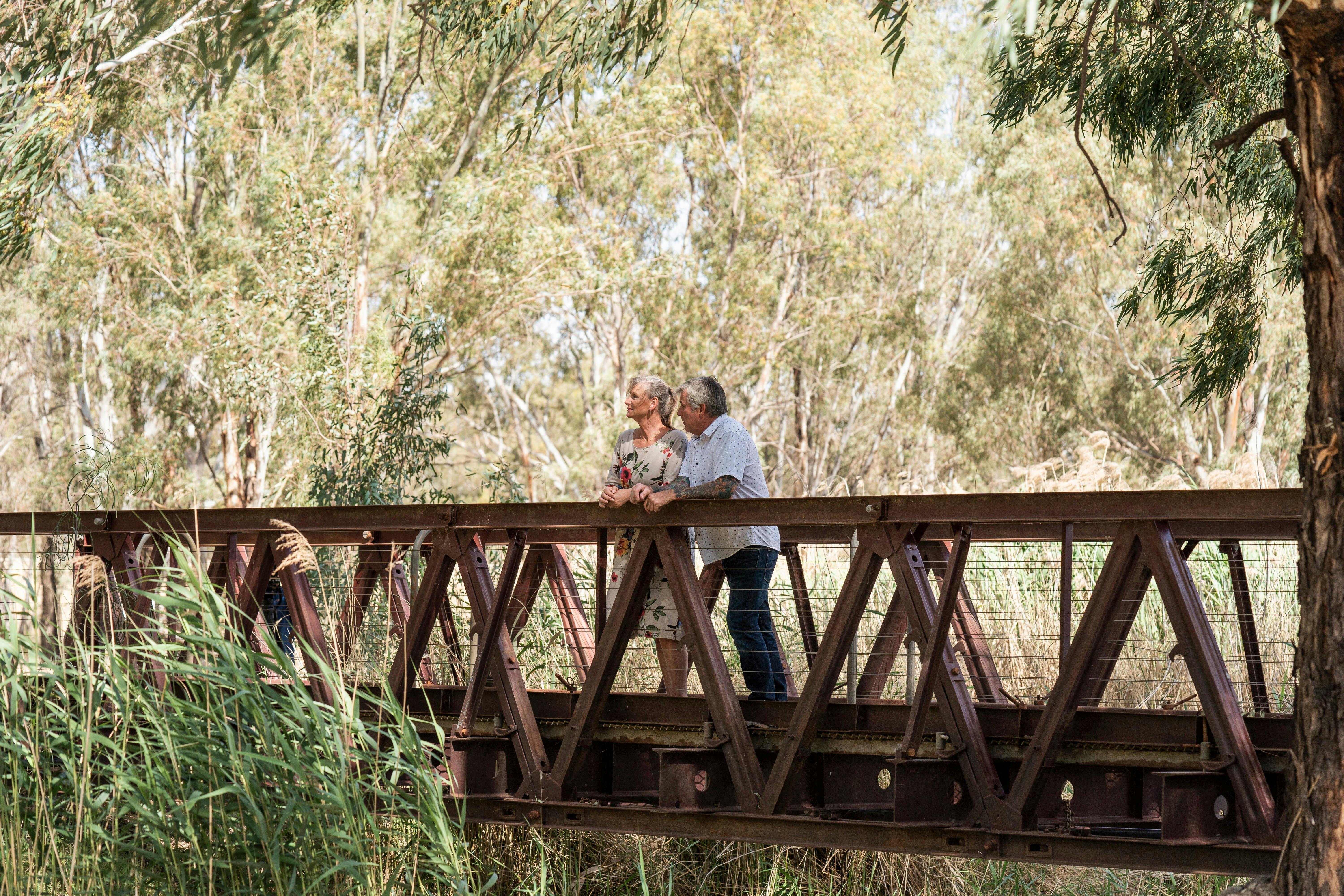 Couple on a bridge overlooking the Narrandera Wetlands