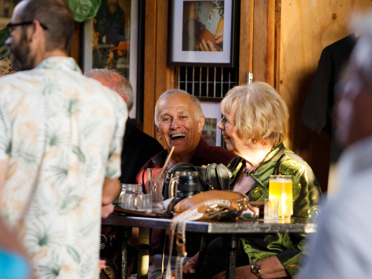 Guests relax over drinks at Granddad Jack’s Craft Distillery