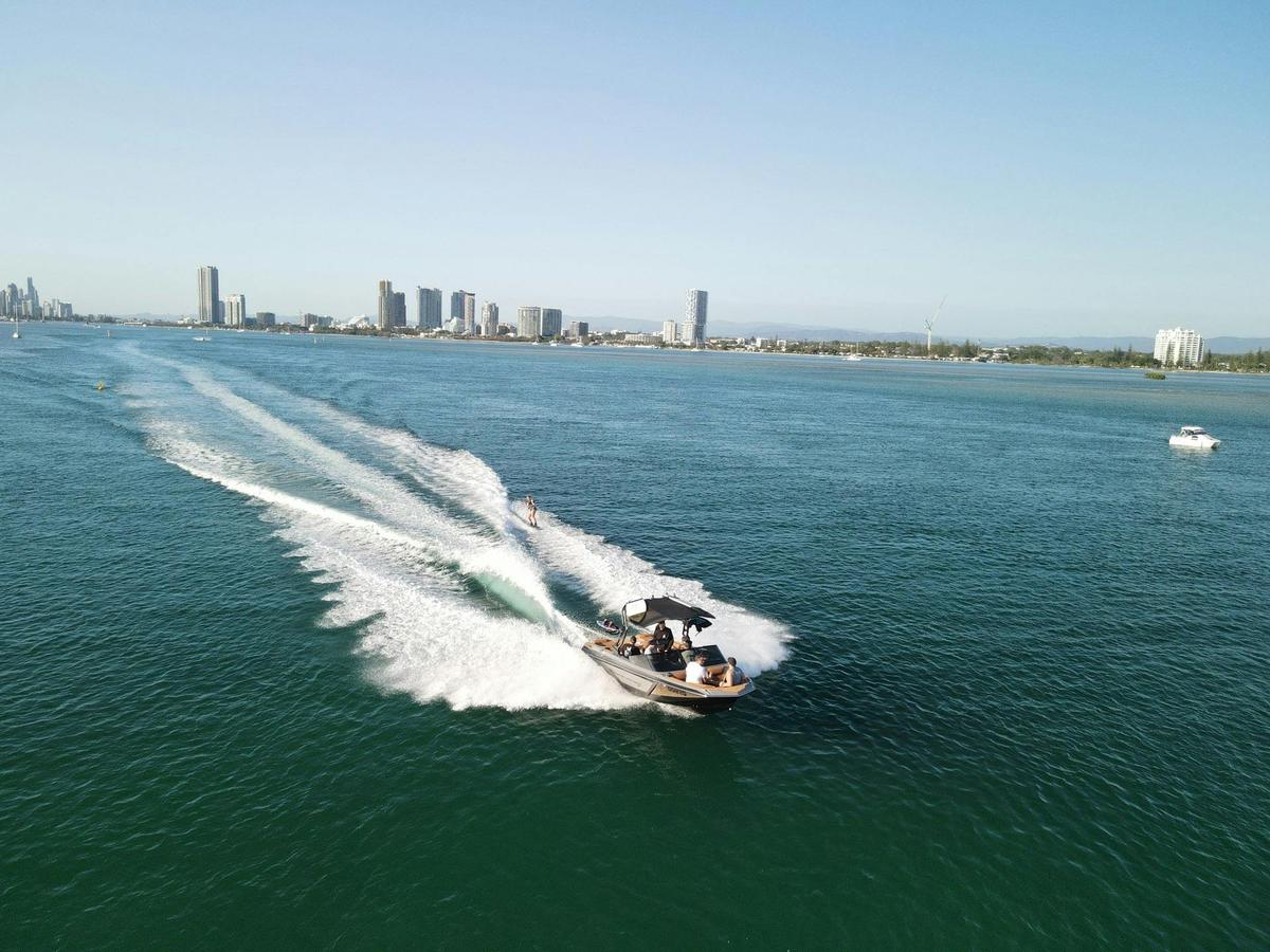 Gold Coast Wake Boat Hire drone footage with the Surfers skyline in the background
