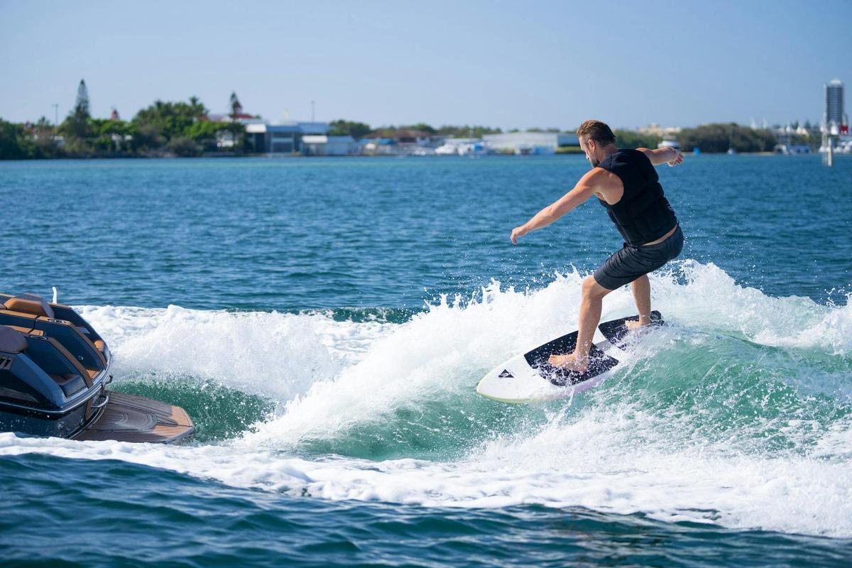 Gold Coast Wake Boat Hire riding an epic wave. Wake Surfing on the Gold Coast Broadwater