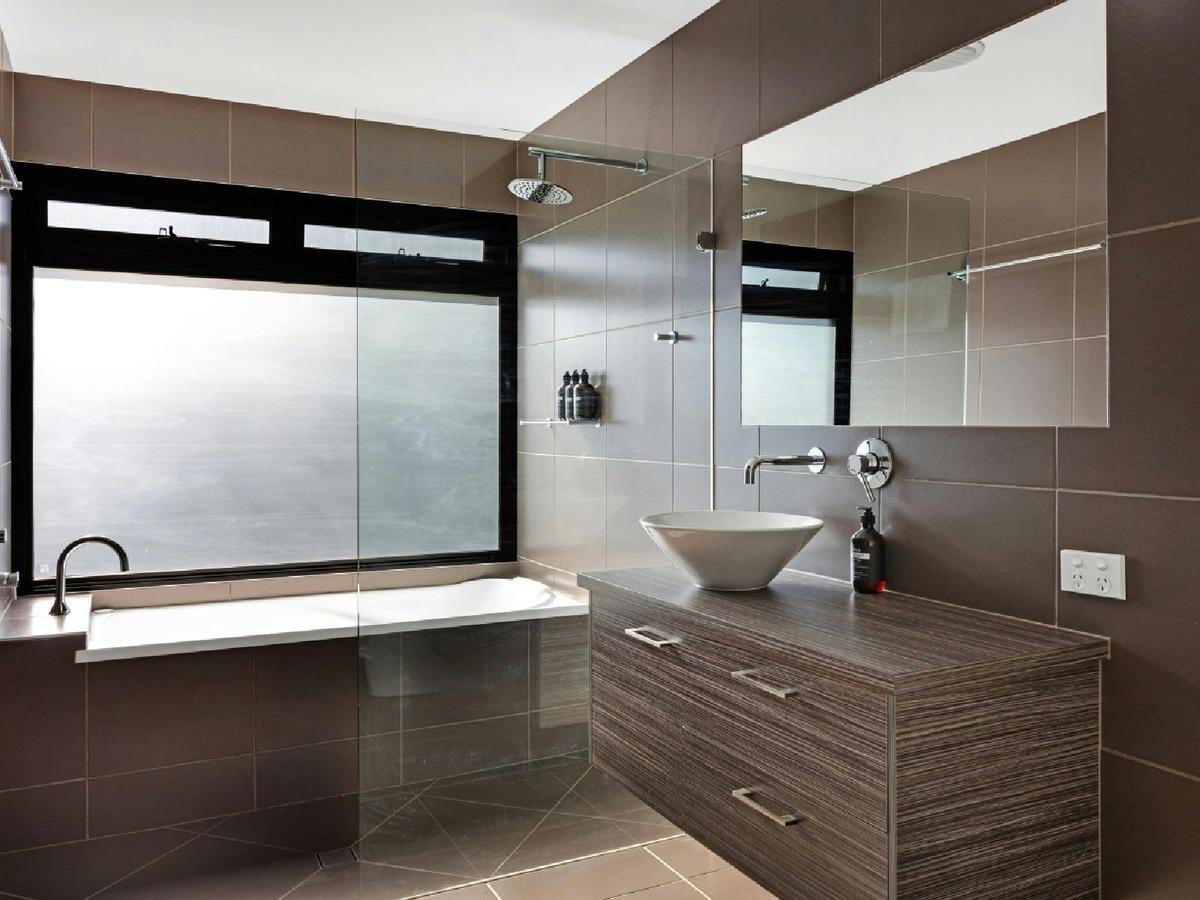 Shared bathroom with bath