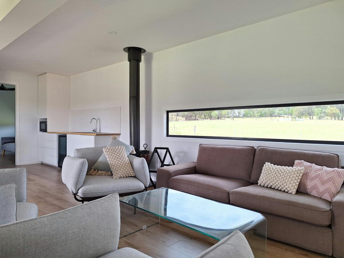 Our open plan living area, complete with fireplace provides the perfect setting to relax.