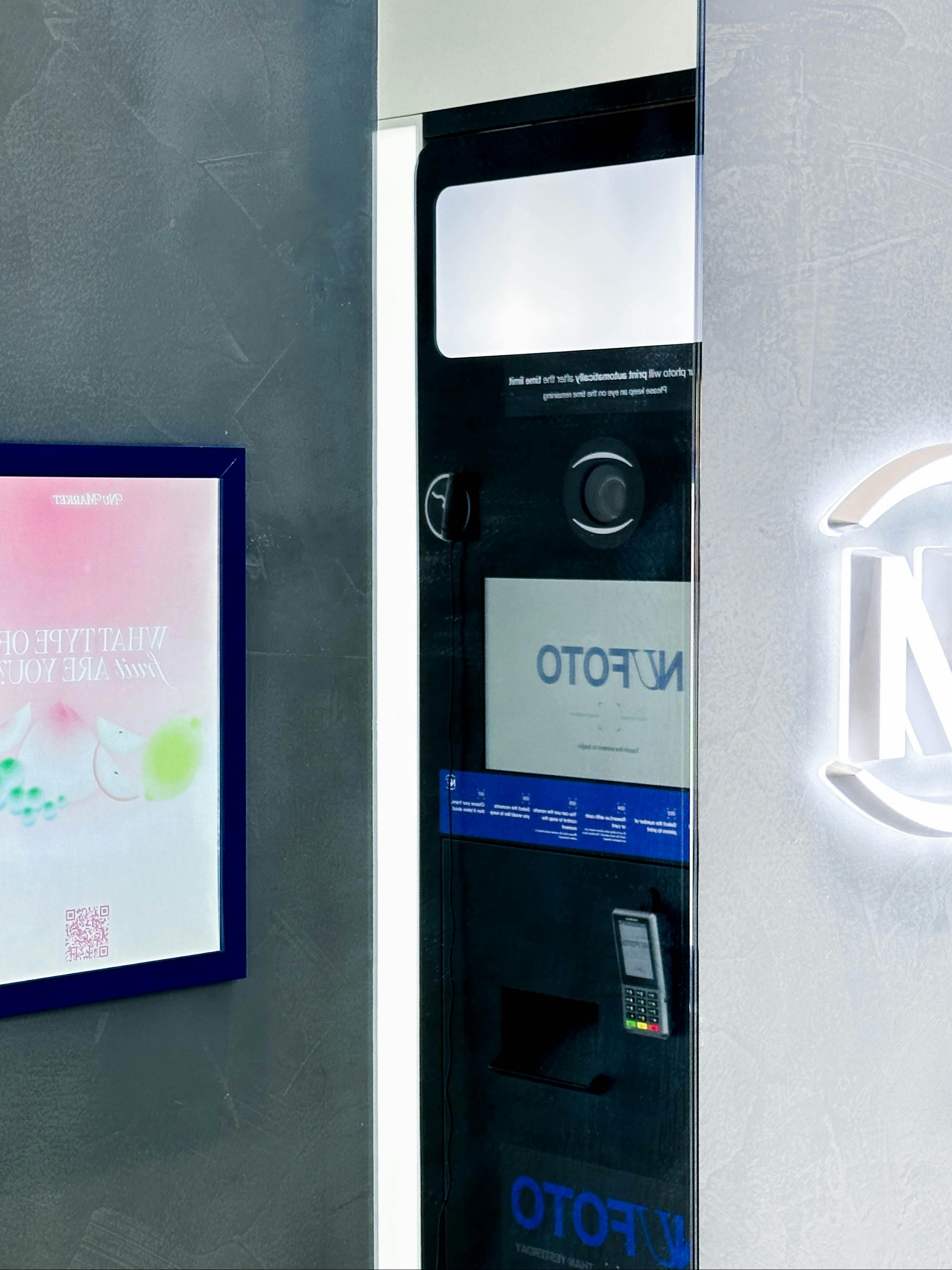 A peak into our booths, shows a reflection of our devices in the mirror