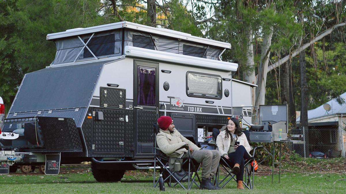 The campsite is leafy with manicured lawns and gardens.