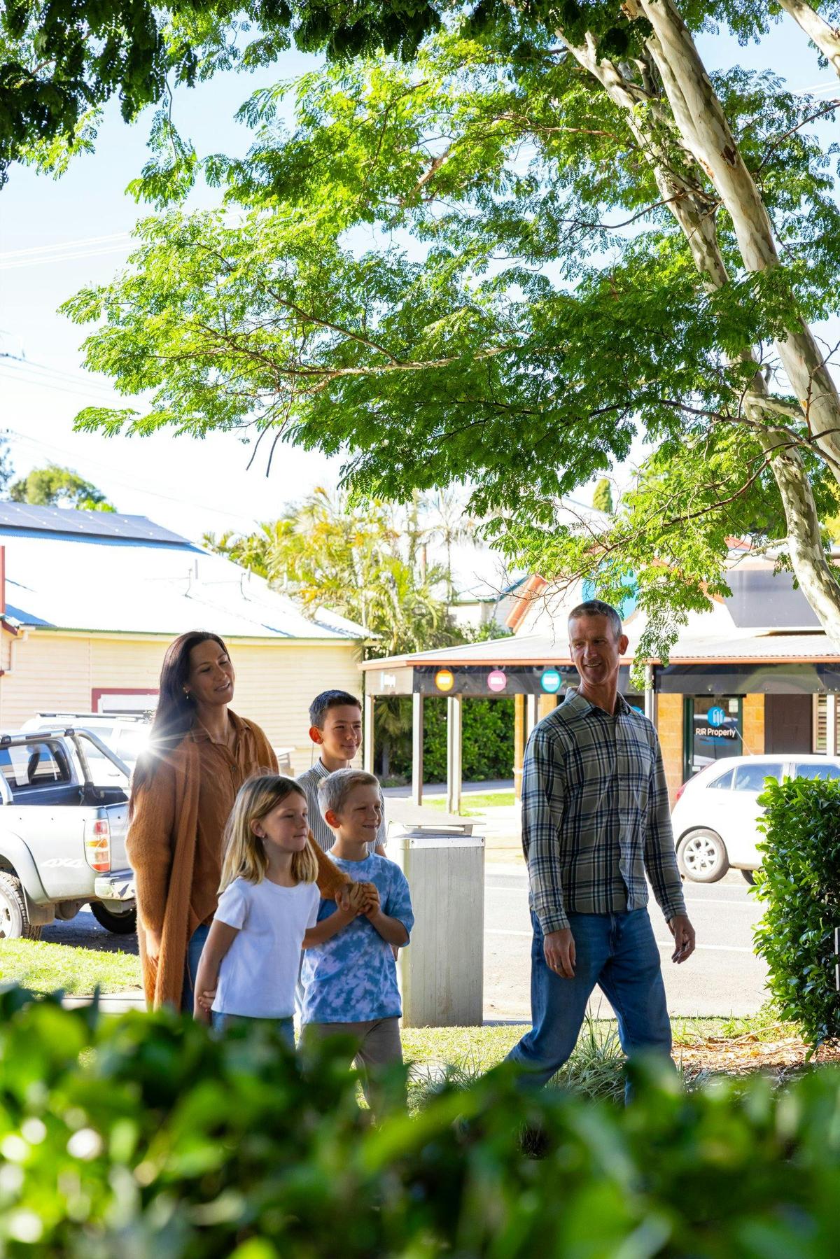 Family walking through the town of Imbil