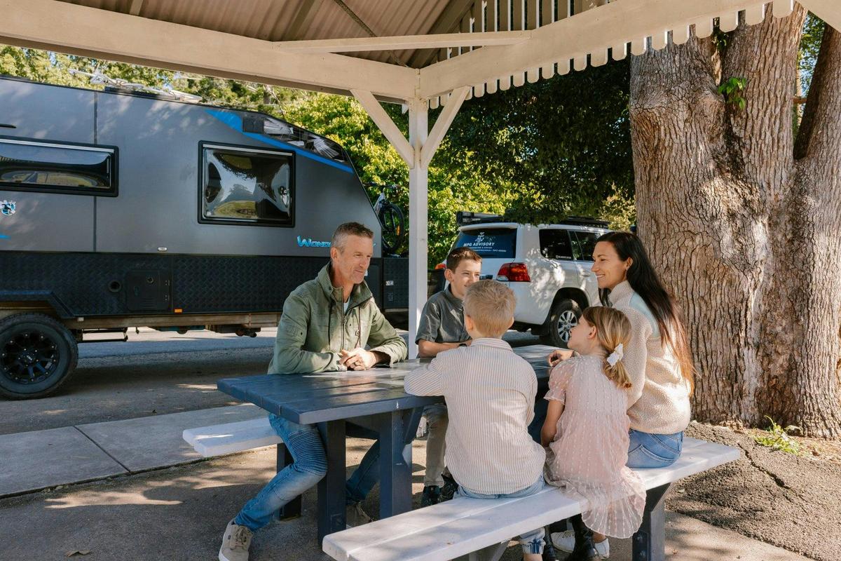 Family sitting at a picnic table