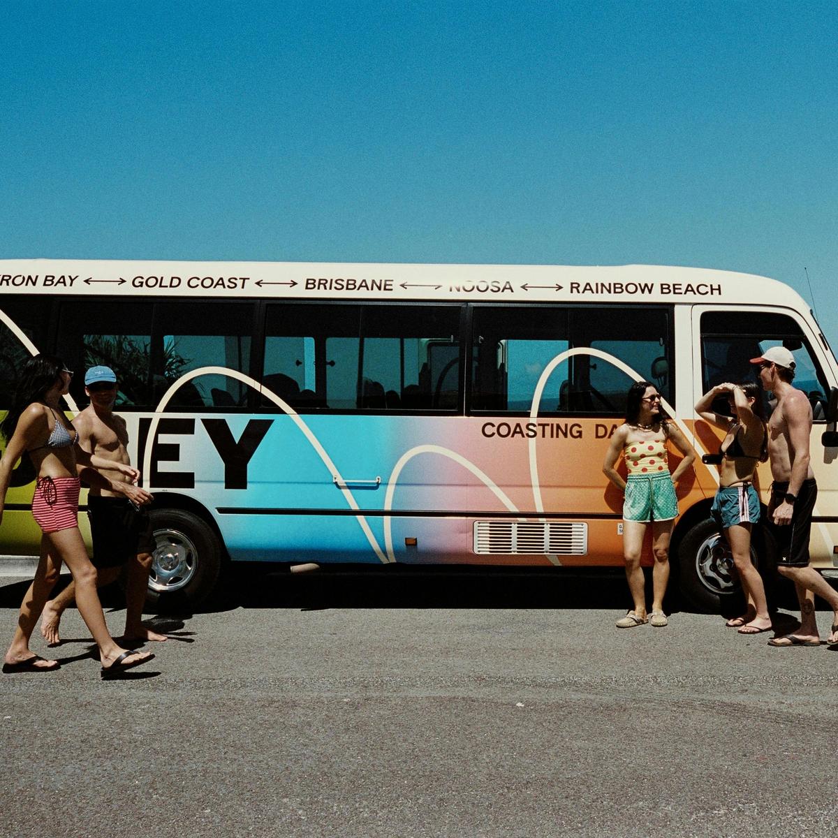 Group of travellers making friends on an East Coast bus trip