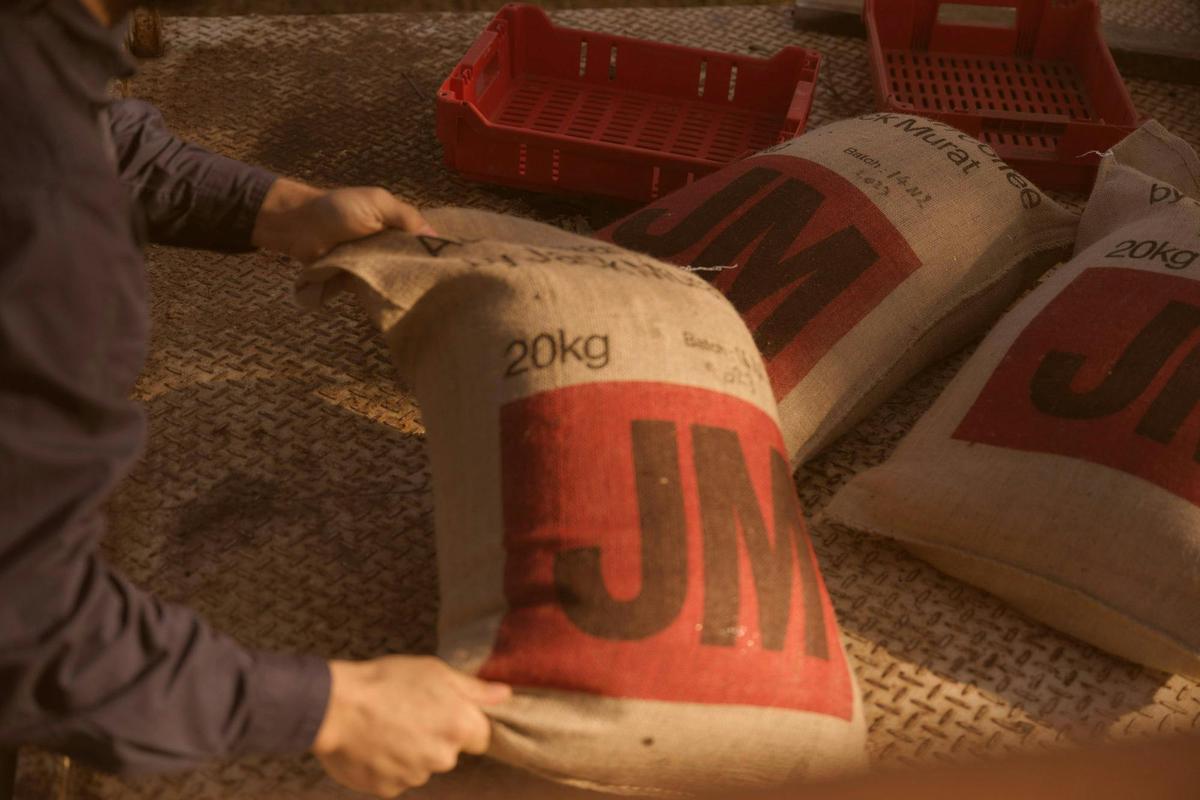 Freshly processed coffee packed into hessian bags on site at the farm.