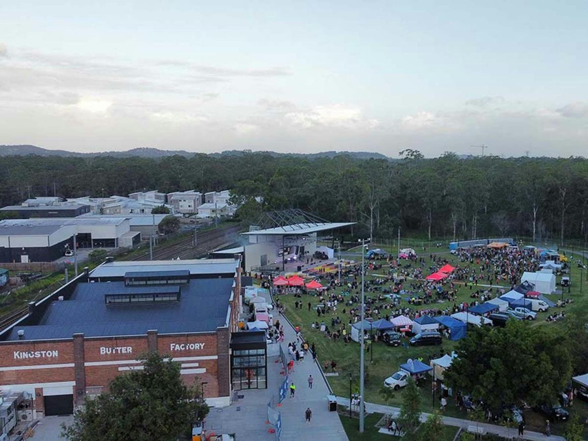 Aerial view of Kingston Butter Factory Cultural Precinct event with outdoor stage green space.