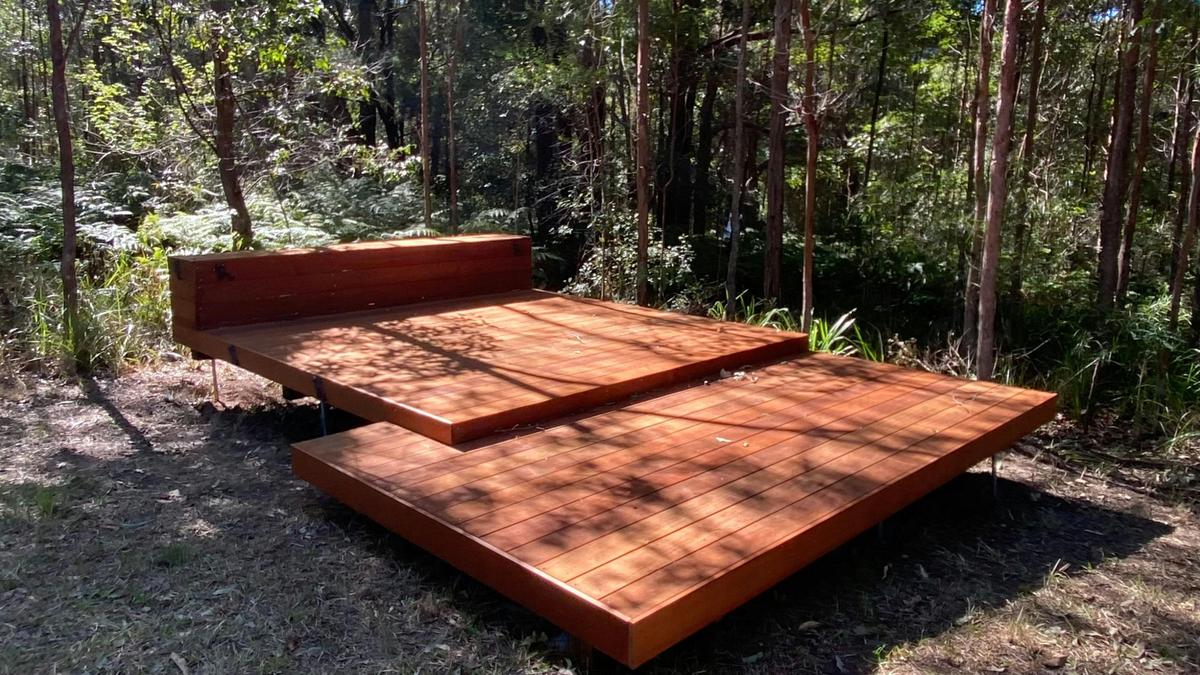 beautiful decking surrounded by trees for pitching your tent
there is also grassed area around to pitch your tent