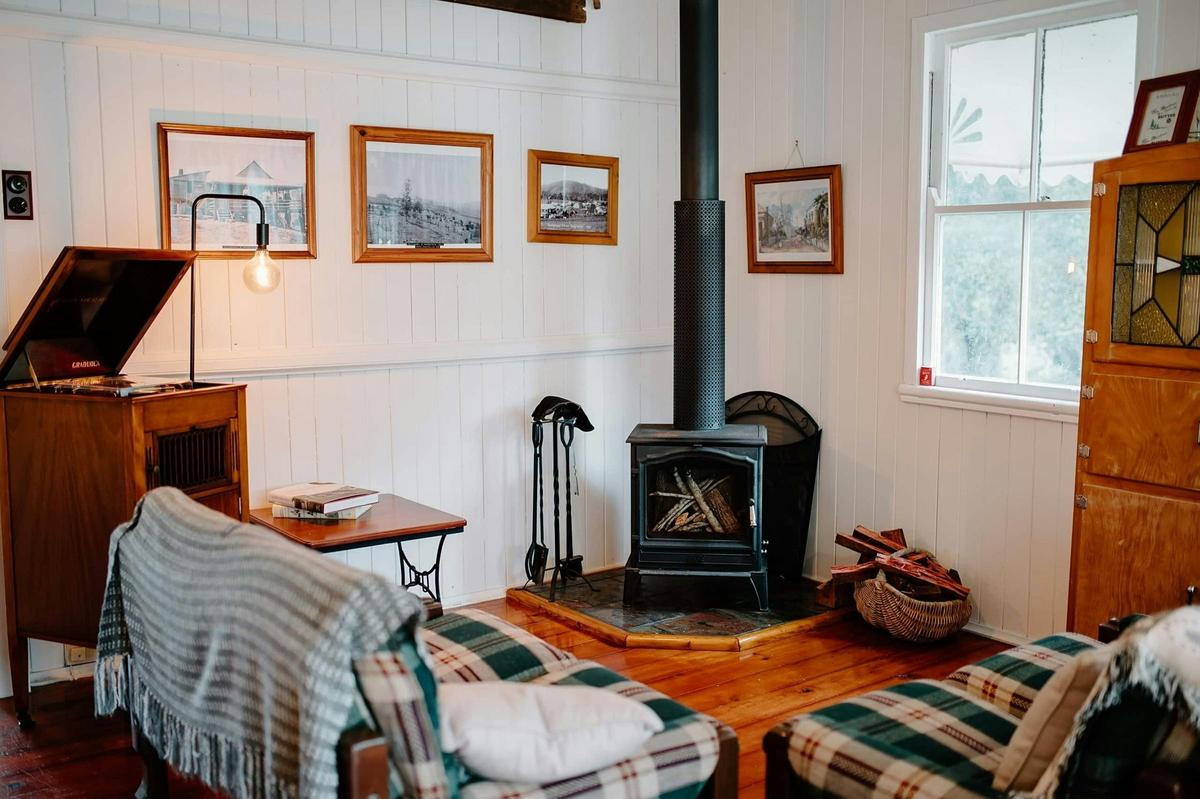 Settle into the character-filled living room beside the wood fire and working record player.