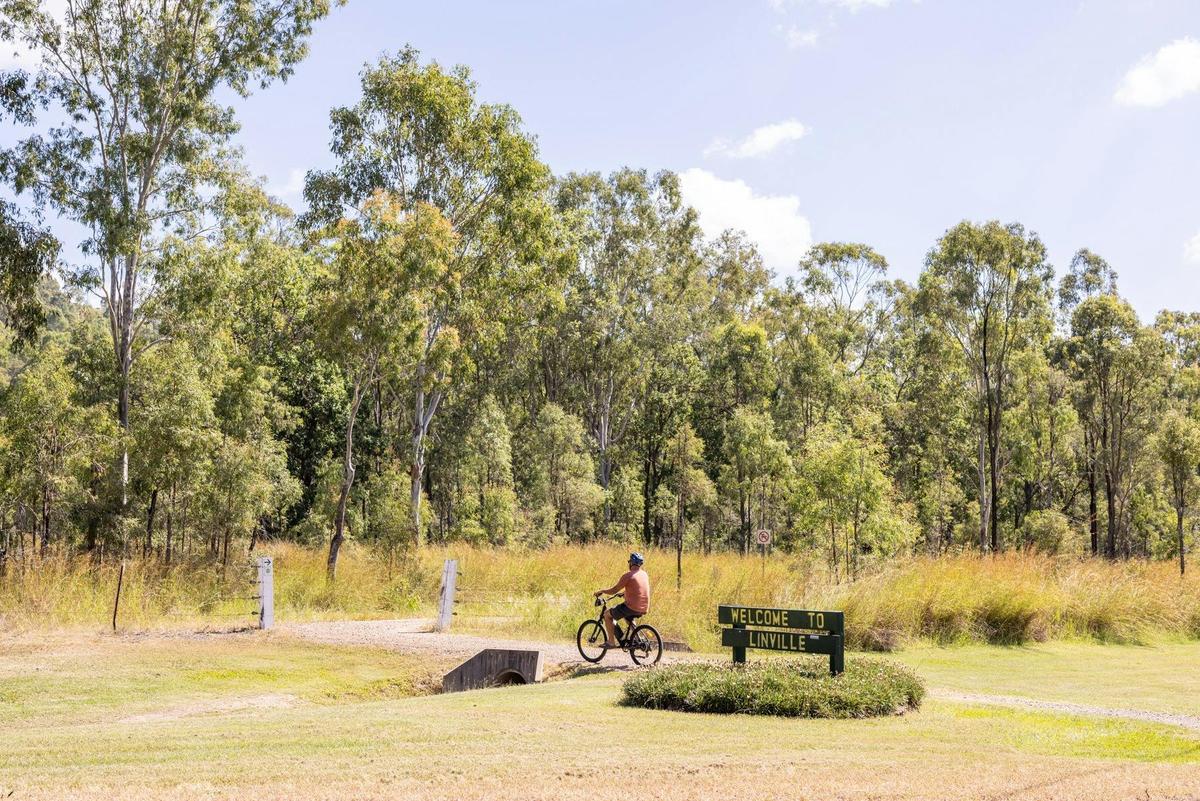Experience Somerset- Cyclists riding along Brisbane Valley Rail Trail at Linville