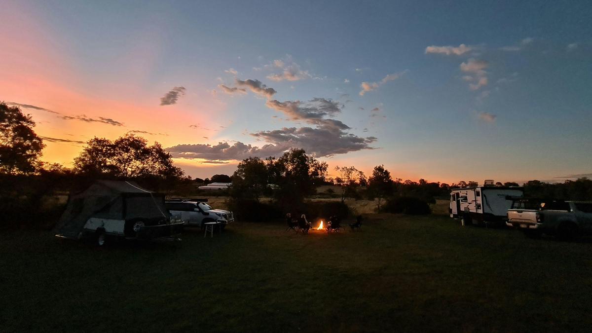 Watching the Beautiful sunset around the campfire