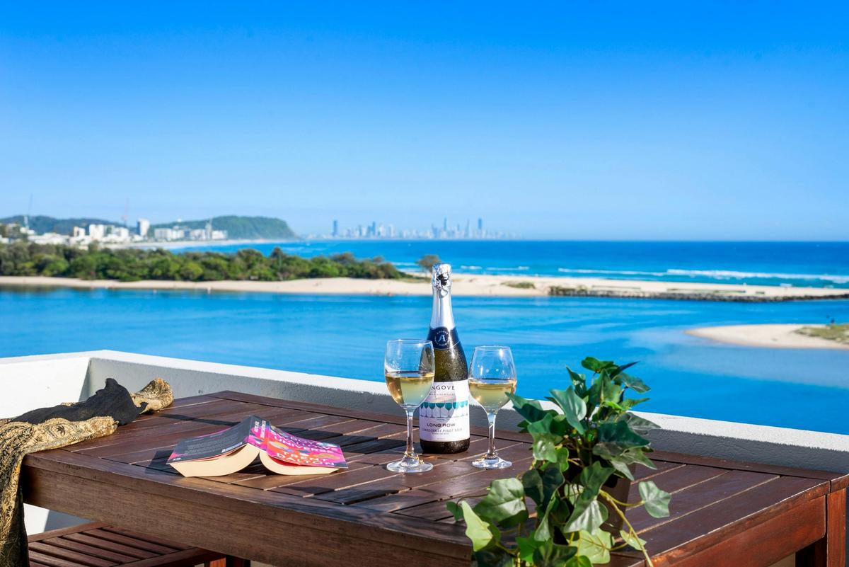 Your happy space...stunning views, best selling book and your favourite wine...