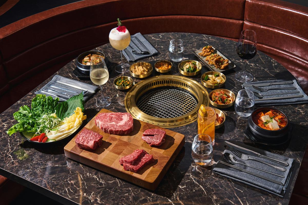 Four cuts of meat on a chopping board