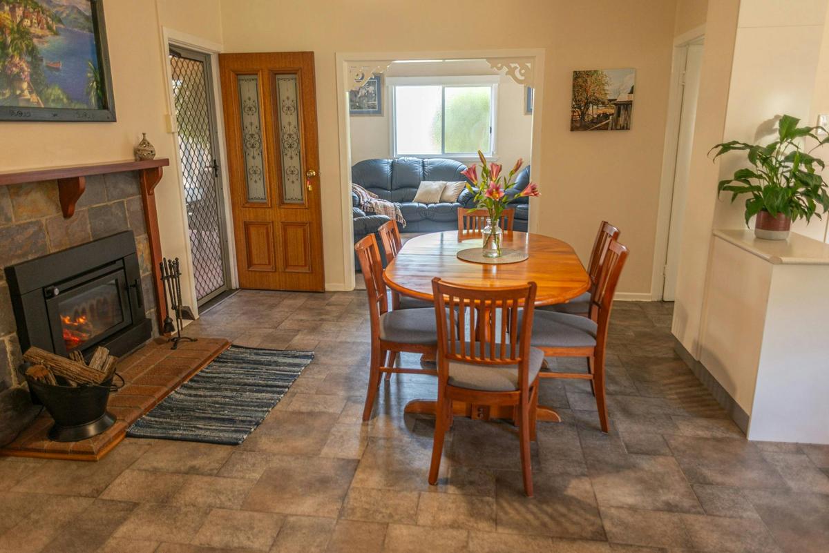 Marnita Farmhouse Dining Room with Fireplace