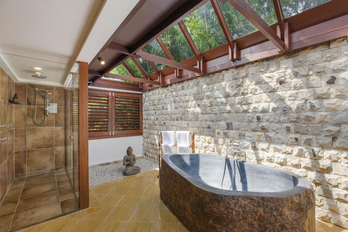 Enjoy a butler bath in our hand carved, volcanic stone bathtub