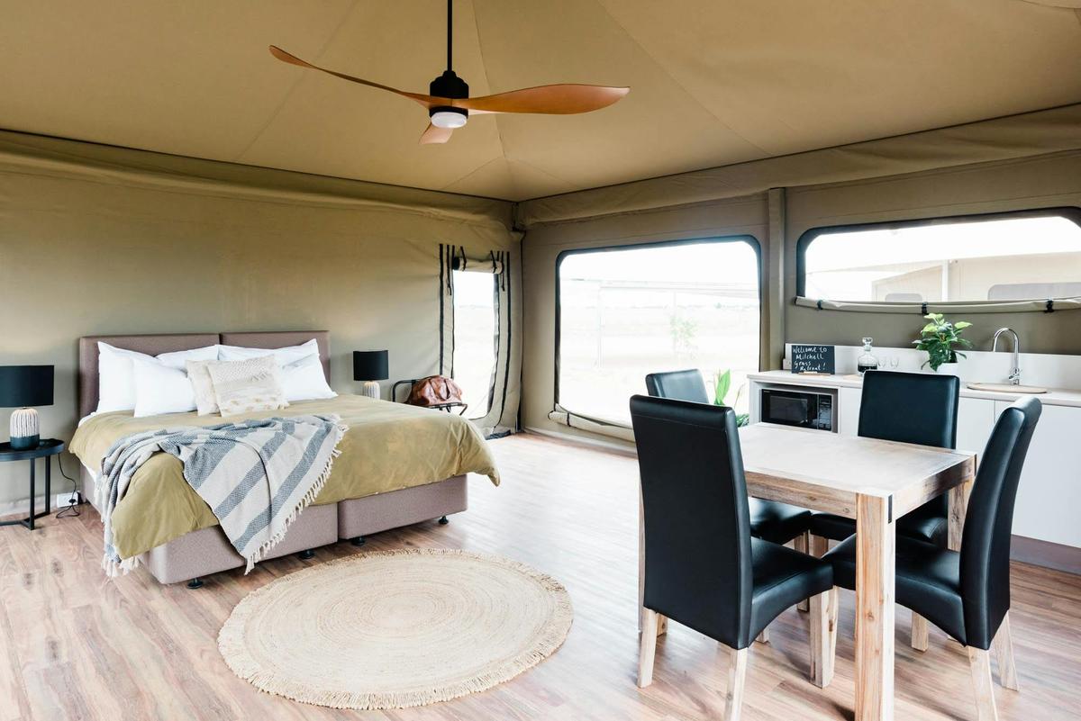 Inside the Mulga tent with ceiling fan and dining table