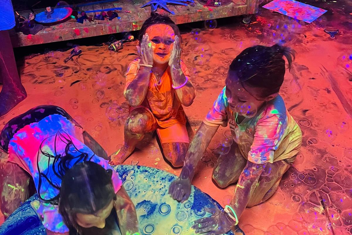 Getting Messy in our UV Paint Party!