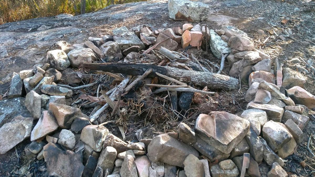 Camp fire on a rocky ridge