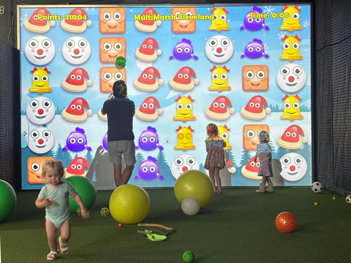 Family game night at interactive sports games at MultiMatch Cleveland in Cleveland Queensland.