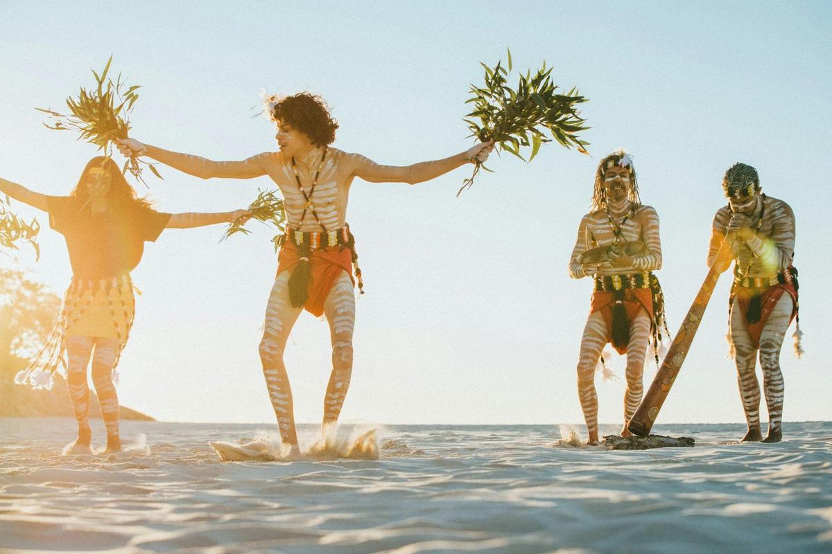 Quandamooka cultural dancers on the Beach, North Stradbroke Island (Minjerribah) QLD