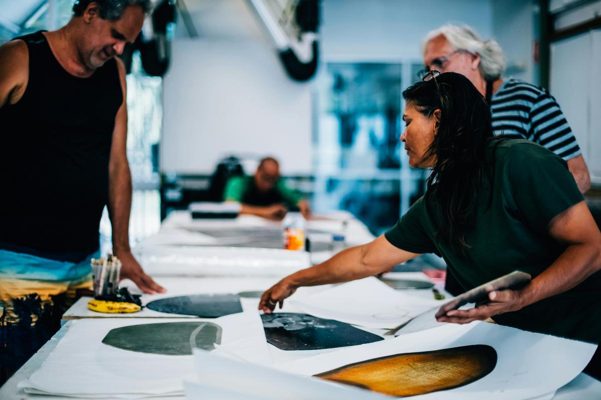 Artists Zane Saunders, Tommy Pau and Sheryl Burchill in printmaking workshop at NorthSite Art Studio