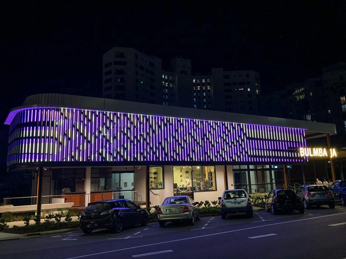 NorthSite Galleries at Bulmba-ja Art Centre by night, artwork by young Yidinji artist Raymond Clarke