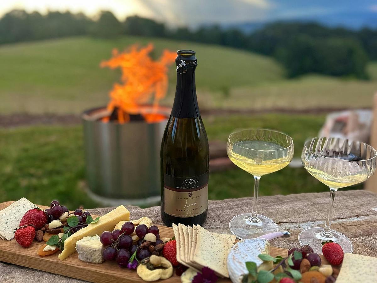 Charcuterie Box set out by the Outdoor Firepit at Pat's Farm Chalets.