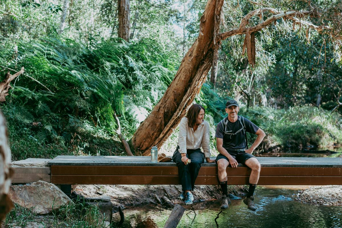 Relaxing on a creekside bridge at Redlands Track Park, Redlands Coast