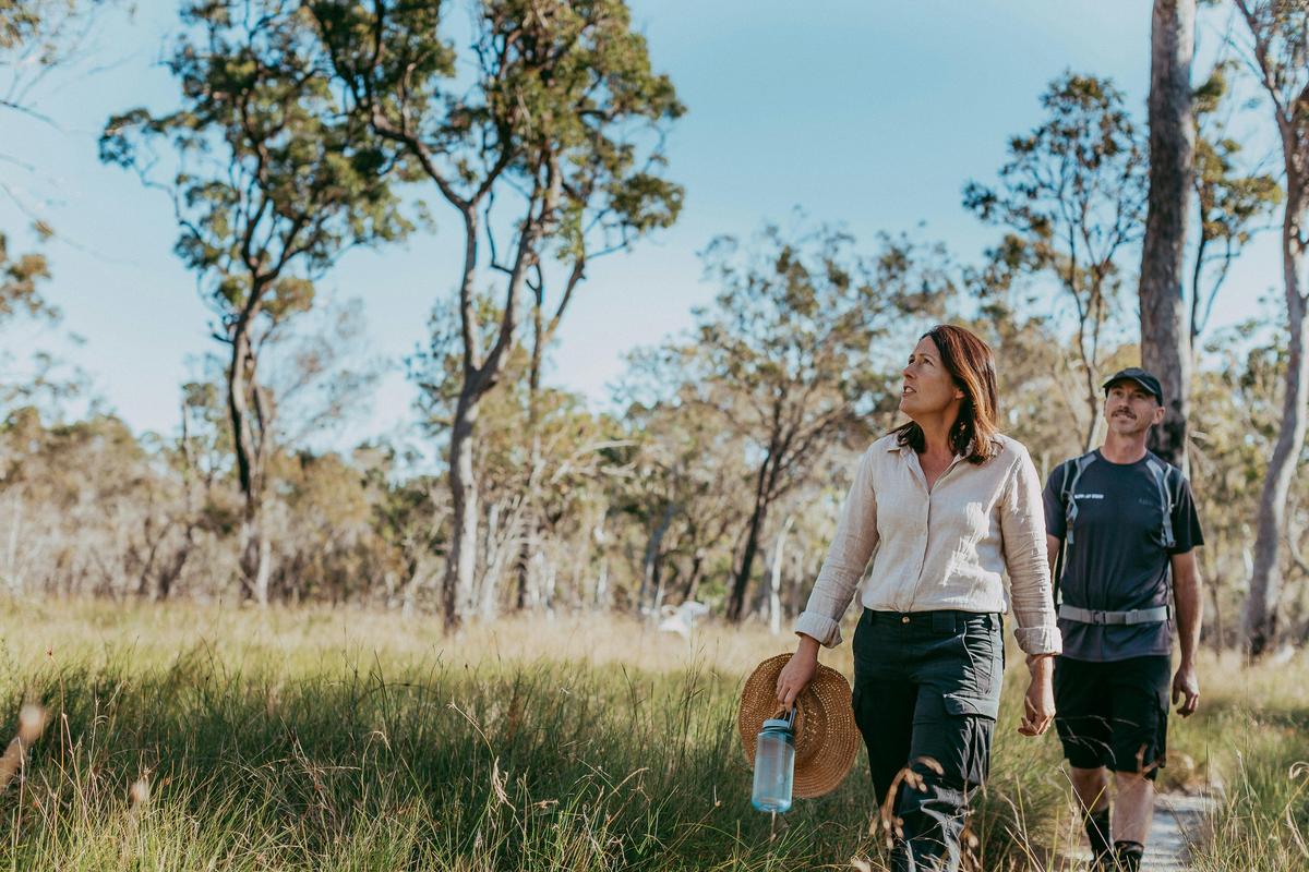 Woman and Man Walking Through Redlands Track Park, Redlands Coast