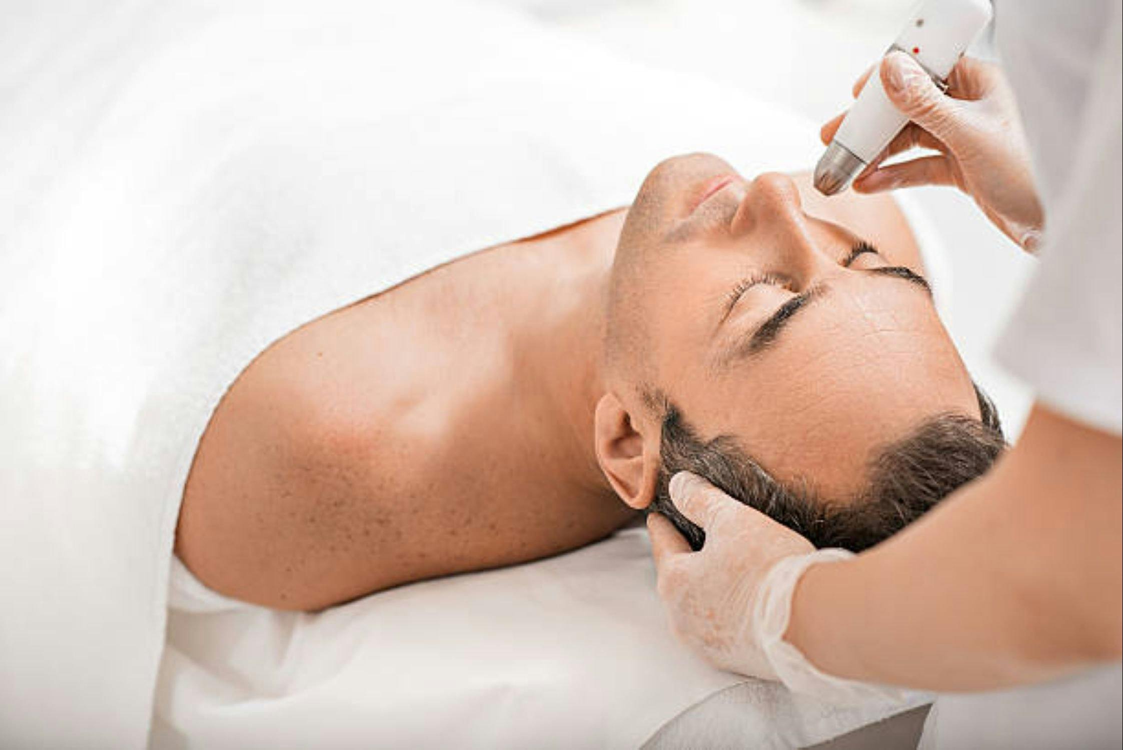 Male receiving facial treatment