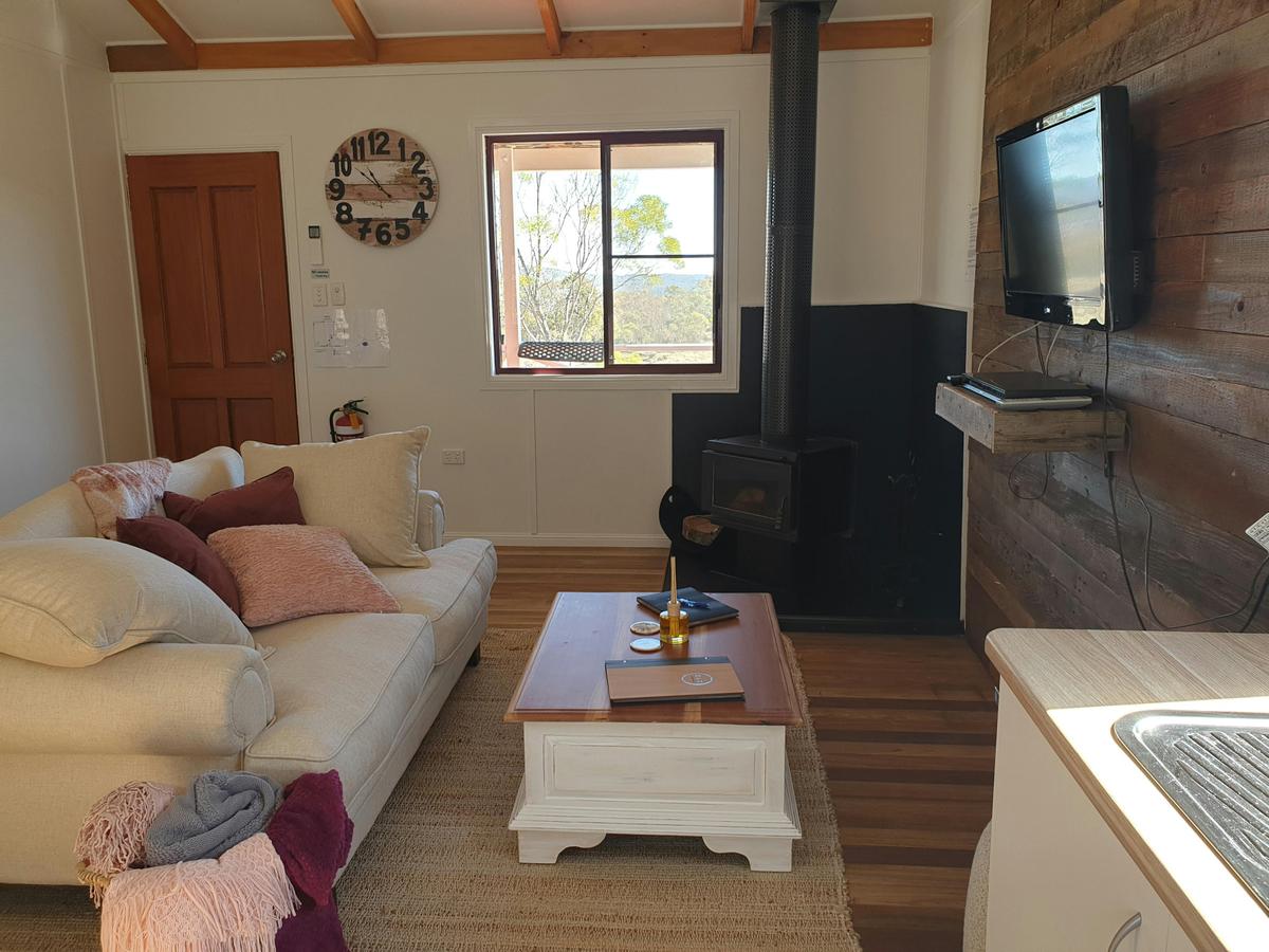Cosy lounge area with tv and log fireplace