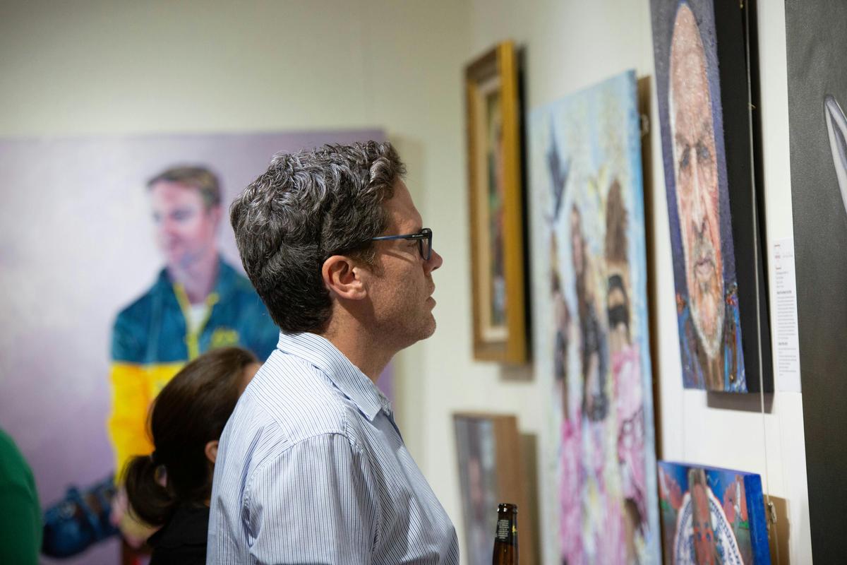 Visitor enjoying an RQAS exhibition.