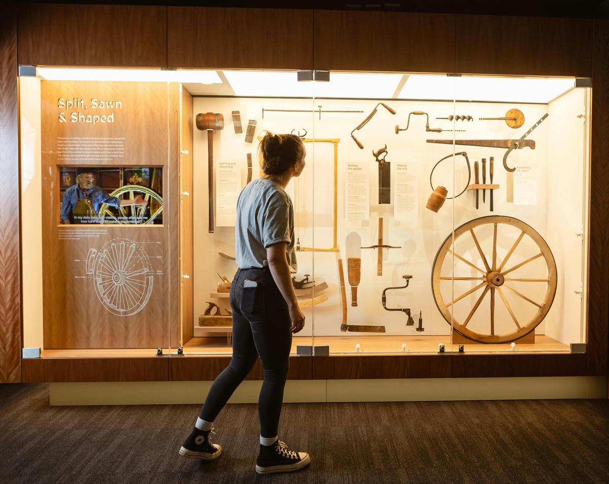 Woman looking at display of hand tools