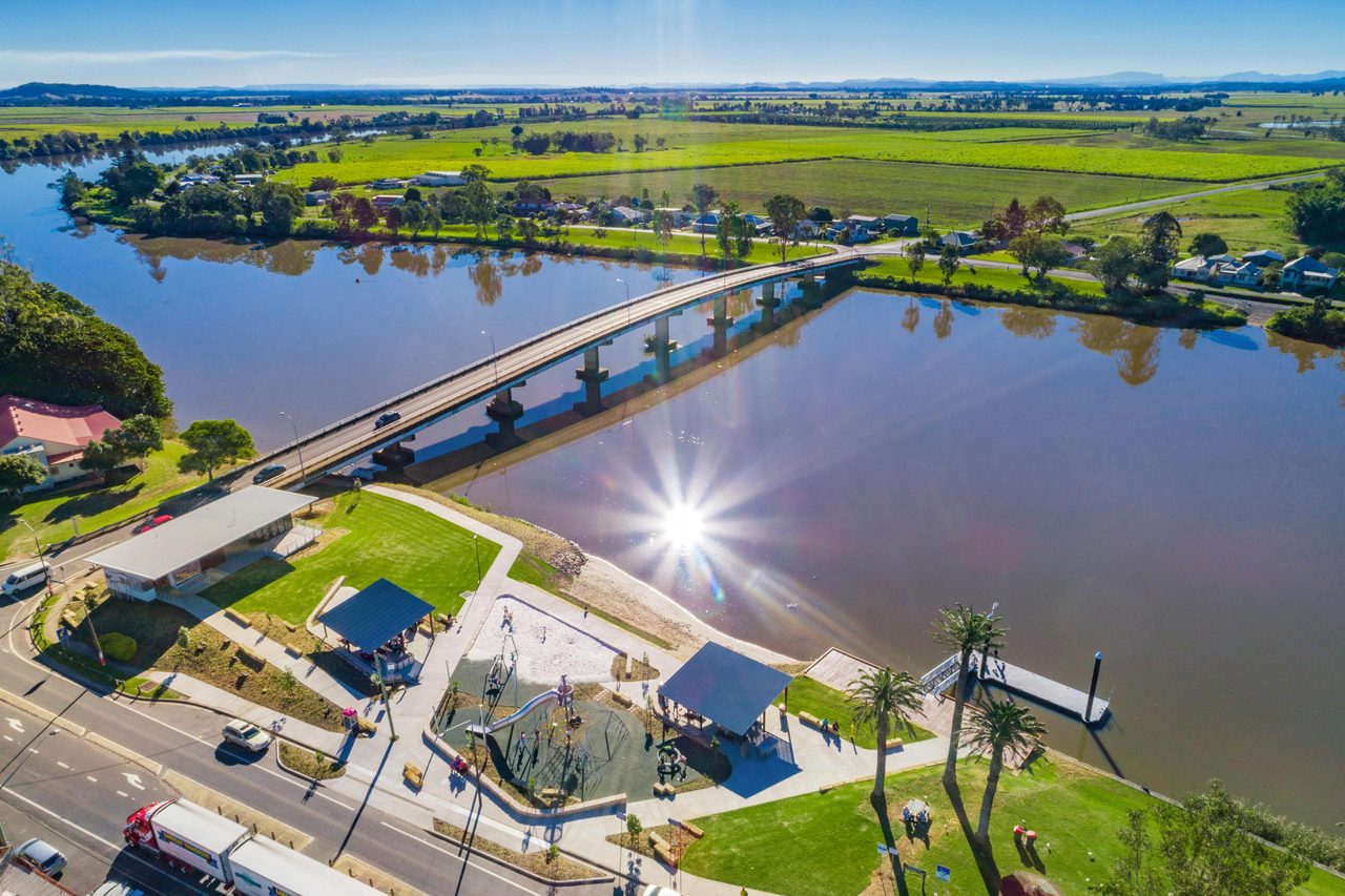 Aerial shot looking over Woodburn featuring the river, bridge and Woodburn Riverside Park.