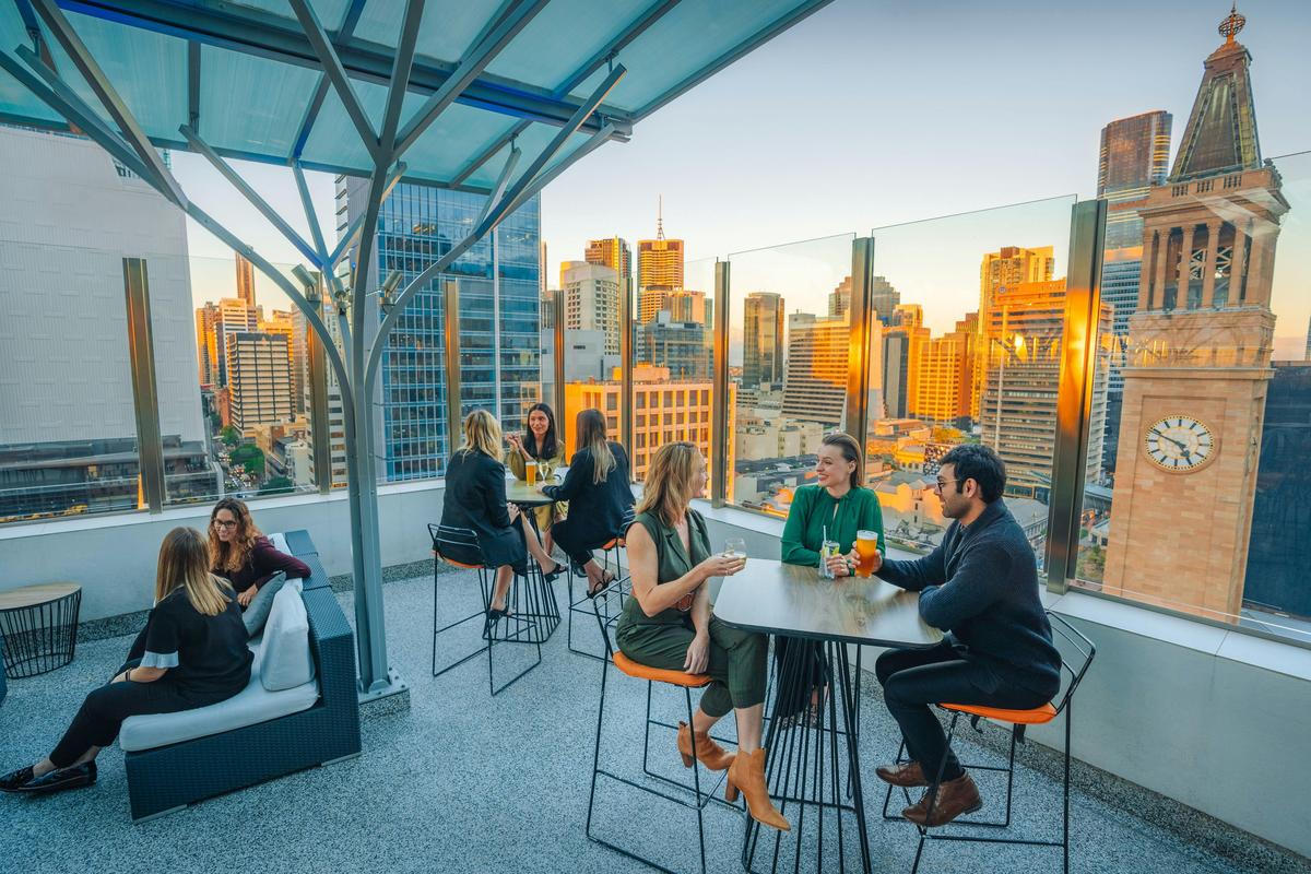 Sixteen Antlers Rooftop Bar, cocktails and sunset overlooking the city skyline