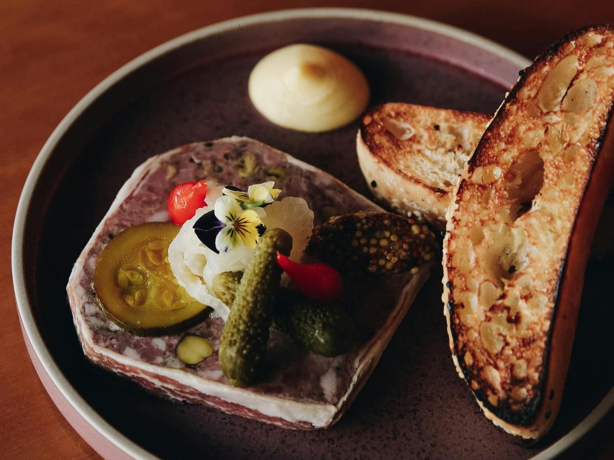 Our 'Signature House Terrine' with apple butter, truffle seeded mustard & zucchini pickles.