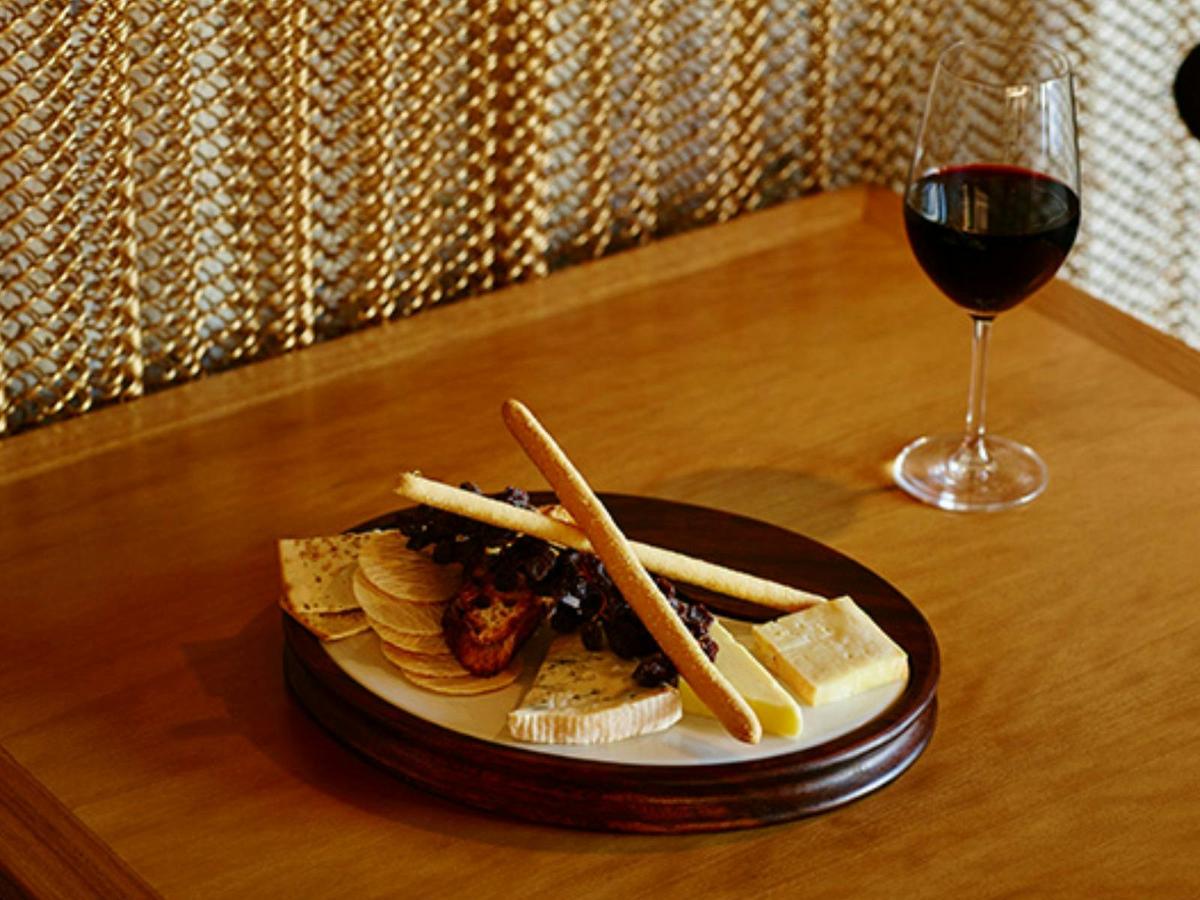 Savour a gourmet cheese plate & explore our exquisite wine selection.