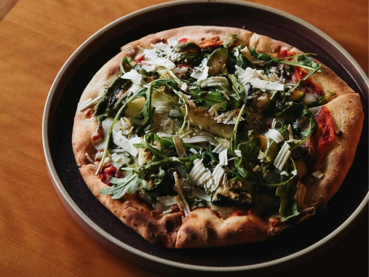 Enjoy stone baked pizza from shaved jamon serrano, grilled zucchini to truffled mushroom flavours.