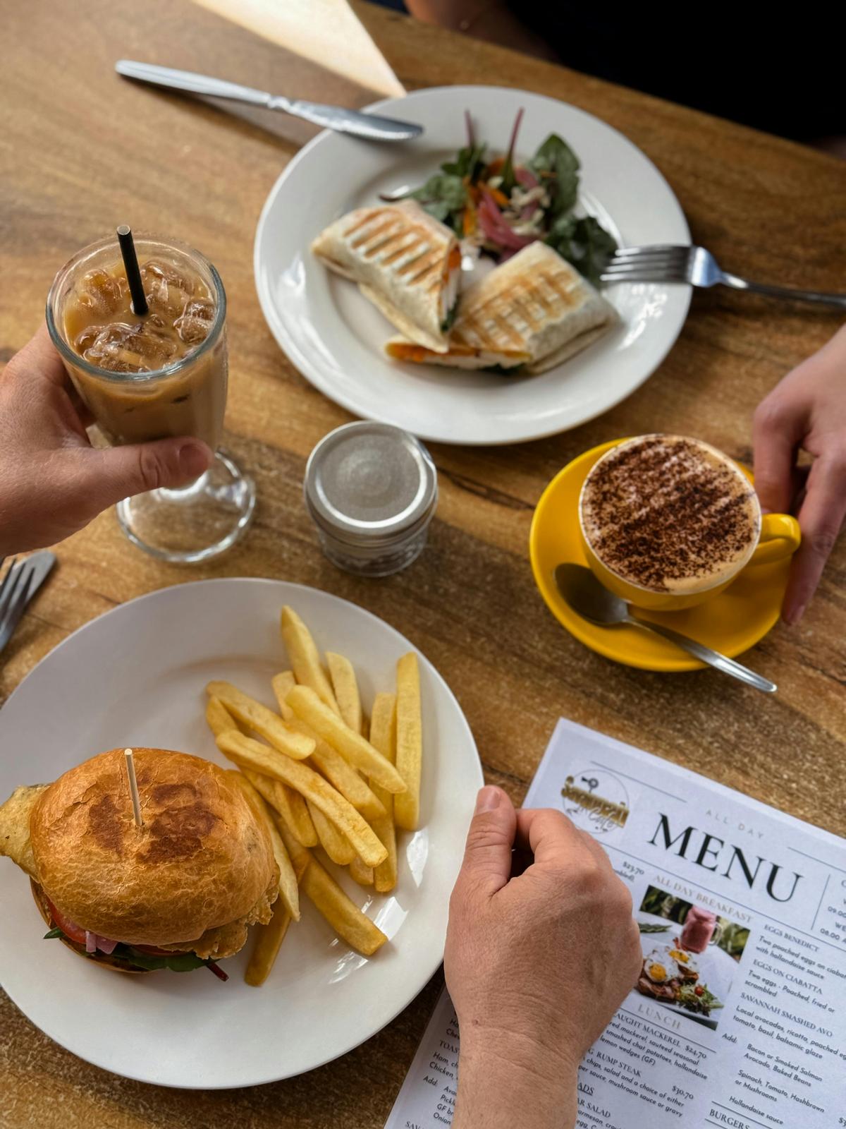 Burger and wrap with coffees