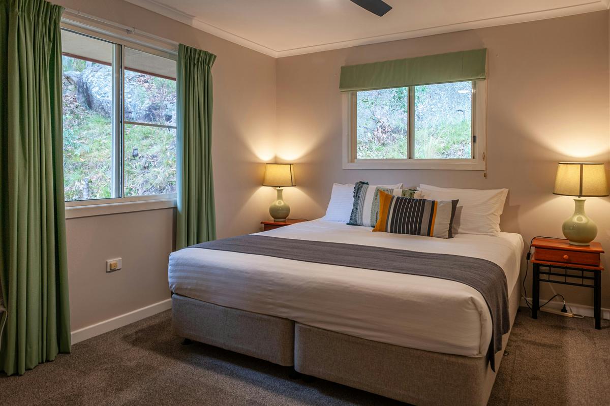 King bed in Bedroom 2 in Shiraz Cottage at Sancerre Estate in Ballandean, Queensland