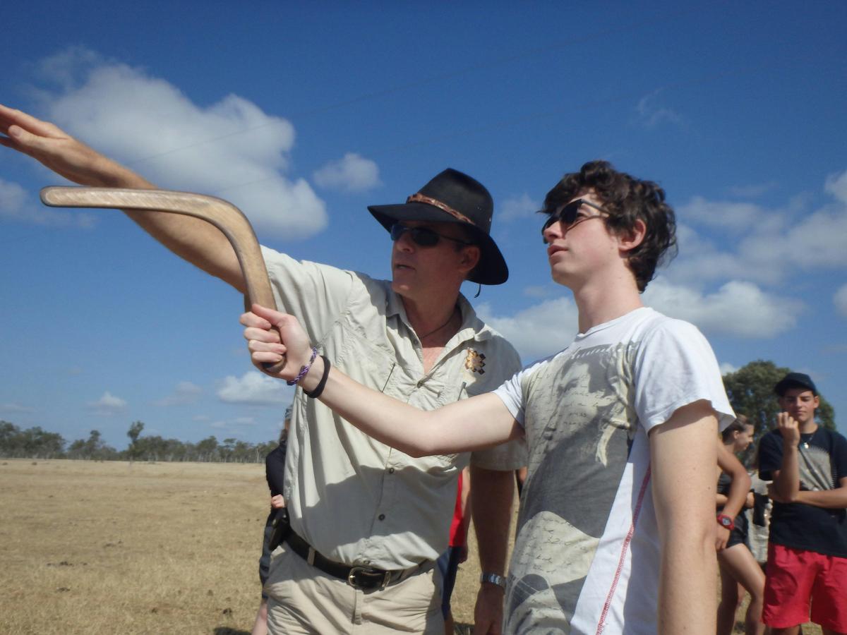 Students learnign to throw boomerangs on outback cattle station