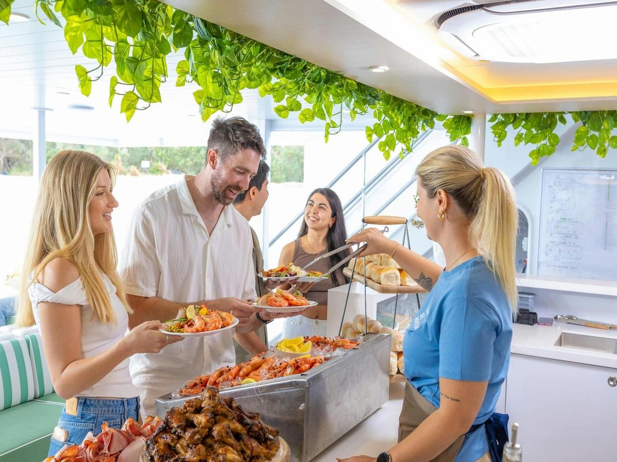 Feast on a tropical buffet lunch with prawns aboard the luxurious See Moreton vessel