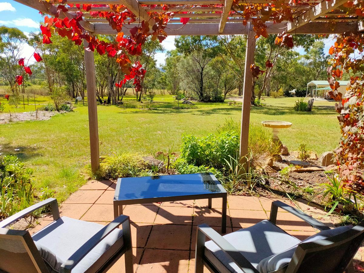 The peaceful garden terrace at Orchard Cottage